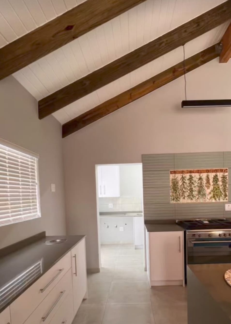 Custom high-gloss white kitchen cupboards in a West Coast home