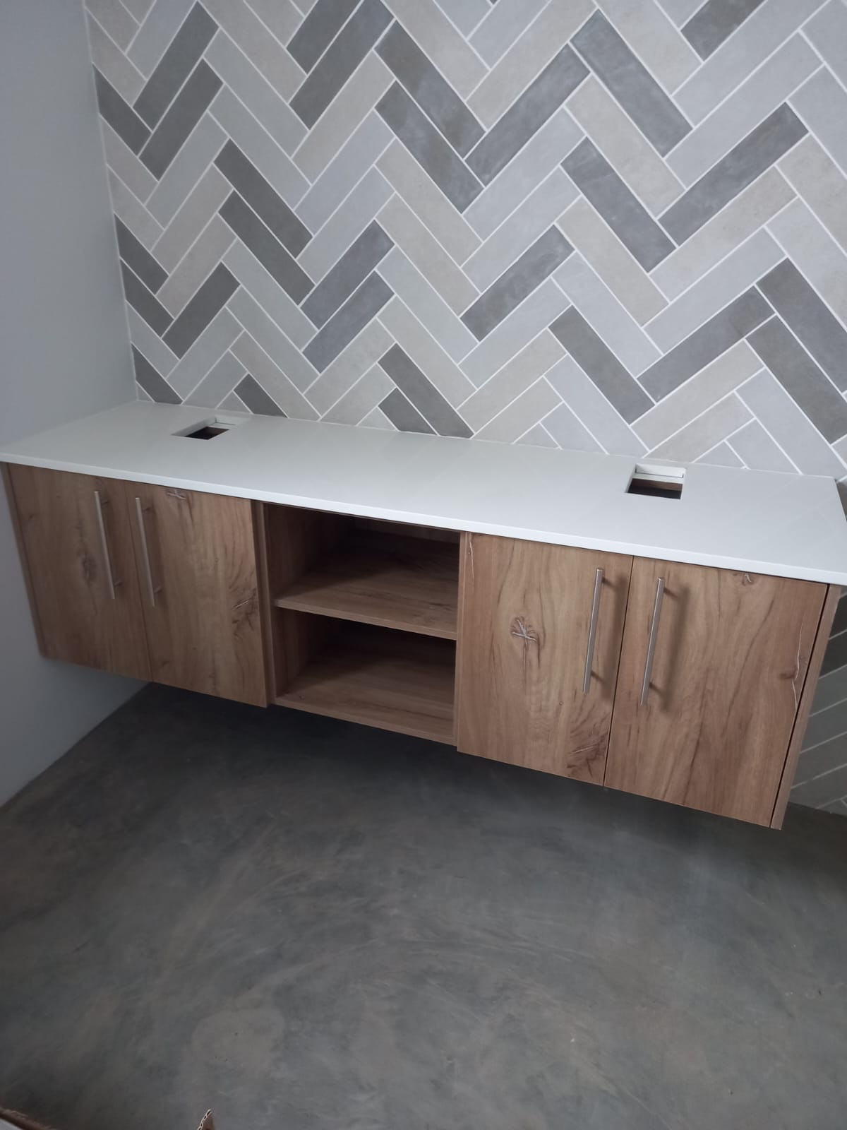 Open-plan kitchen with wooden finishes and white cabinetry