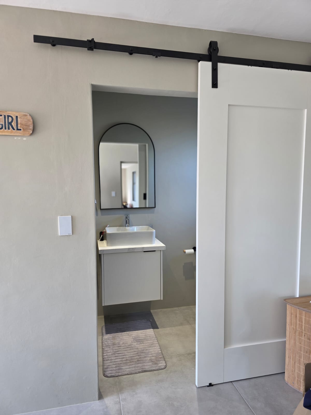 Wooden floating shelves installed in a kitchen for open storage